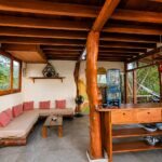Workspace and living area with jungle views at the Playa Yankee retreat