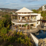 Round hilltop home above the Pacific with pool and ocean views