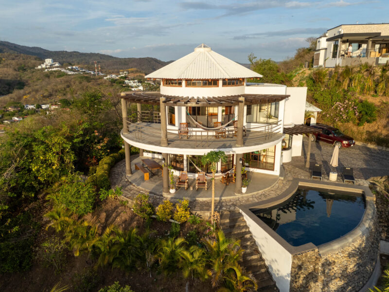 Round hilltop home above the Pacific with pool and ocean views