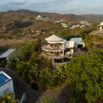 Aerial showing the hilltop home above the Pacific Marlin coastline