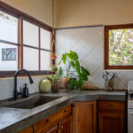 Kitchen counter and sink with a garden window