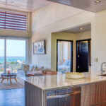 Luxury in-town ocean-view condo living area framed by San Juan del Sur bay views