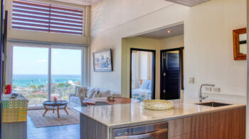 Luxury in-town ocean-view condo living area framed by San Juan del Sur bay views