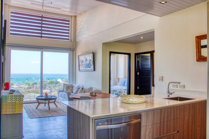 Luxury in-town ocean-view condo living area framed by San Juan del Sur bay views