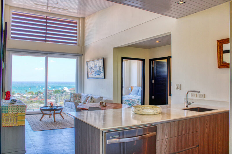 Luxury in-town ocean-view condo living area framed by San Juan del Sur bay views