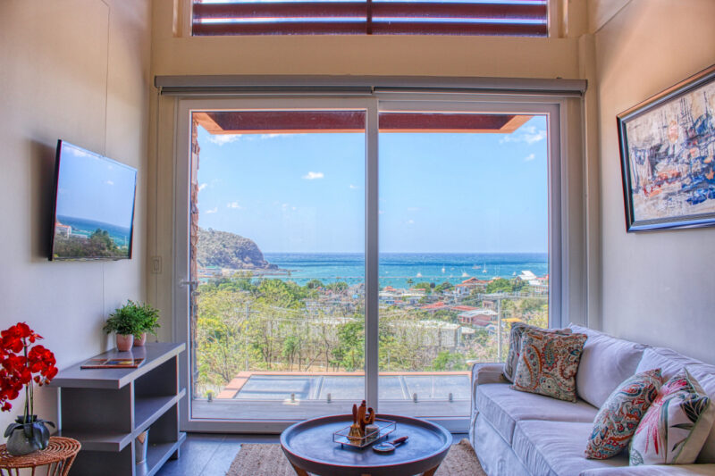 Living room with floor-to-ceiling windows over the bay