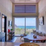 Open living and dining area with panoramic bay views
