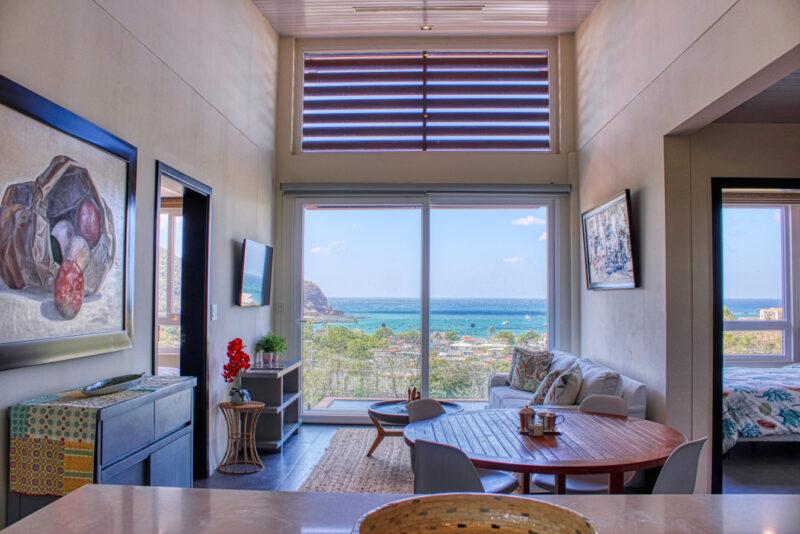 Open living and dining area with panoramic bay views