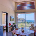 Dining area beside the living room with ocean views