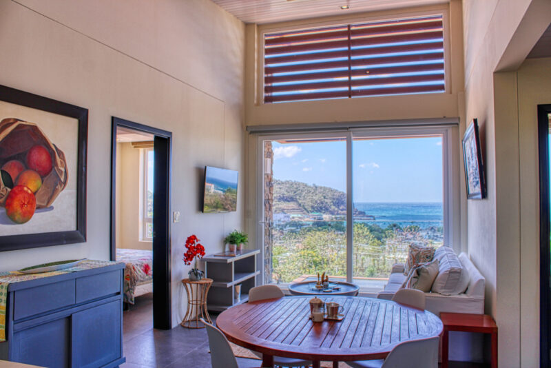 Dining area beside the living room with ocean views
