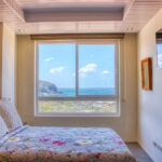 Bedroom with a wood room divider and garden view