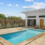 Private pool and patio beside the home