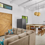 Open-plan living, dining, and kitchen in the modern 3-bedroom home