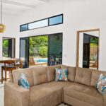 Living and dining area with pool views at the San Juan del Sur home