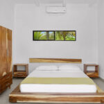 Bedroom with custom live-edge parota furniture