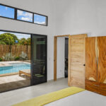 Bedroom with sliding doors to the pool