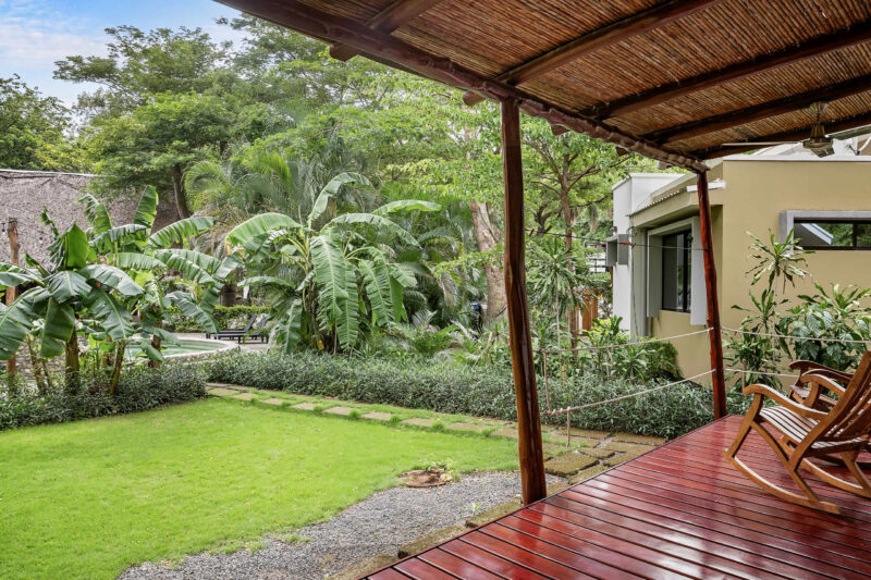 Covered terrace at this Hacienda Iguana eco casita, opening to the lawn