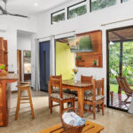Kitchen island and dining space with garden views