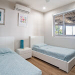 Bedroom with two twin beds and garden light