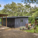 Front exterior of the modern home in the Santa Isabel forest