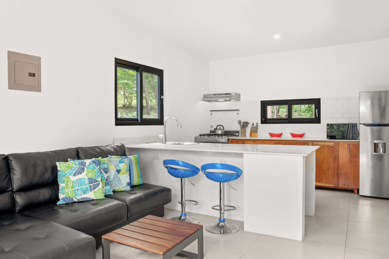 Open living room and kitchen with a granite island