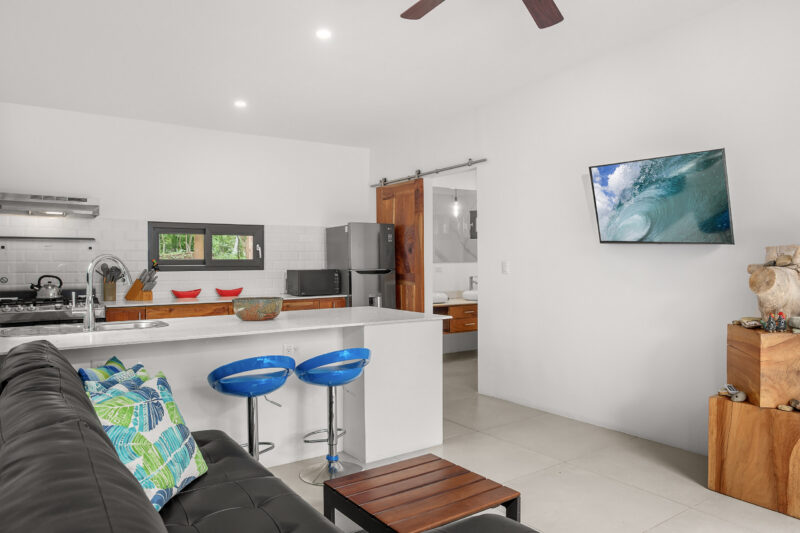 Kitchen island with breakfast seating and stainless appliances
