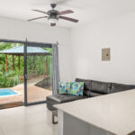 Living area with sliding glass doors to the pool