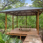 Shaded outdoor palapa for dining or yoga