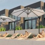 Sun loungers and shade umbrellas along the terrace