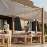 Oceanfront wellness area with massage tables