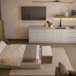Furnished studio interior with a kitchenette