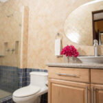 Tiled bathroom with a walk-in shower and vanity