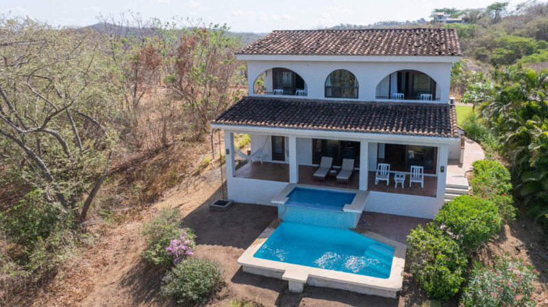 Aerial view of the home, pool, and gardens at Rosada Seascape