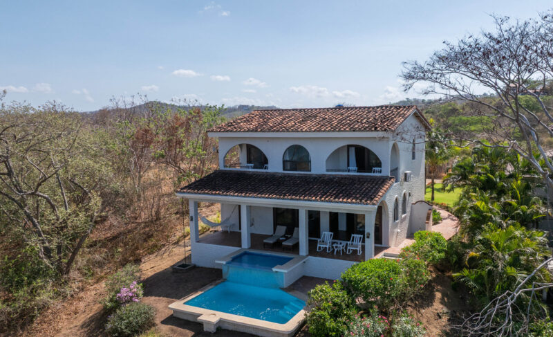 Aerial of the two-level home above the Rancho Santana hills