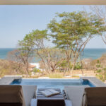 Poolside porch framing the Pacific views