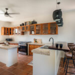 Open kitchen with an island and wood cabinetry