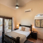 Bedroom with air conditioning and balcony access