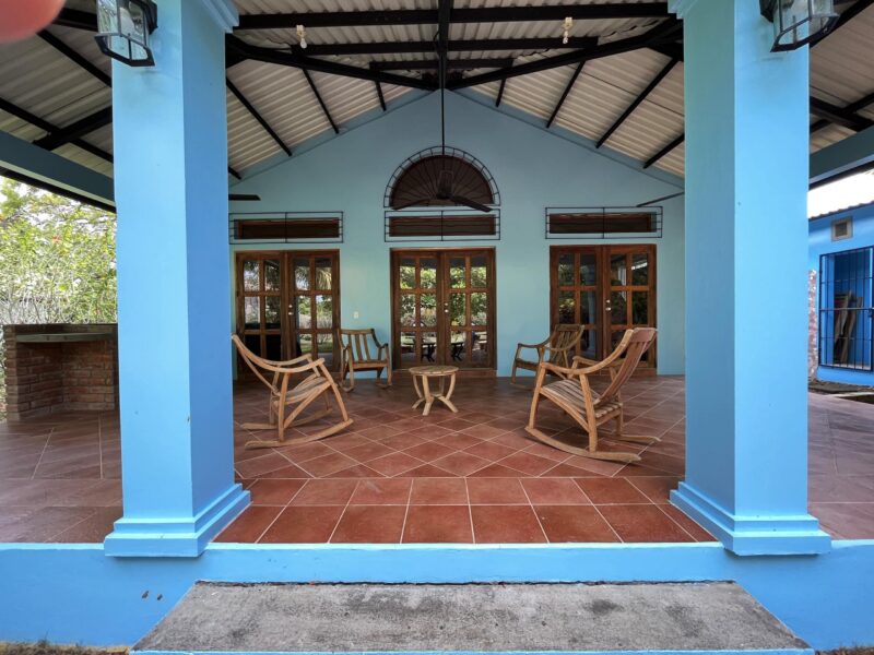 Columned front porch with rocking chairs