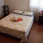 Bedroom with warm terracotta floors