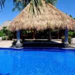 Shared resort pool and palapa at the Surf Sanctuary