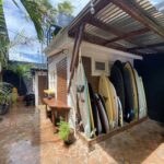 Outdoor patio with surfboard racks