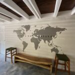 Gathering room with a world-map wall mural