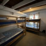 Dormitory-style room with bunk beds