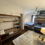 Bunk room with bedside lighting