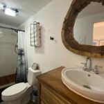 Bathroom with a vanity and mirror