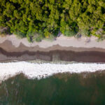 28 acre Pacific beachfront development parcel — overhead of the shoreline and surf