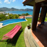 Bay-view home in Pacific Marlin — infinity pool and covered terrace