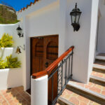 Bay-view home in Pacific Marlin — interior stairway and garden entry