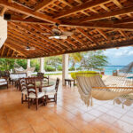 Shaded terrace with a hammock and sea views