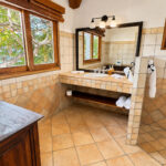 En-suite bathroom with a double vanity and ocean window